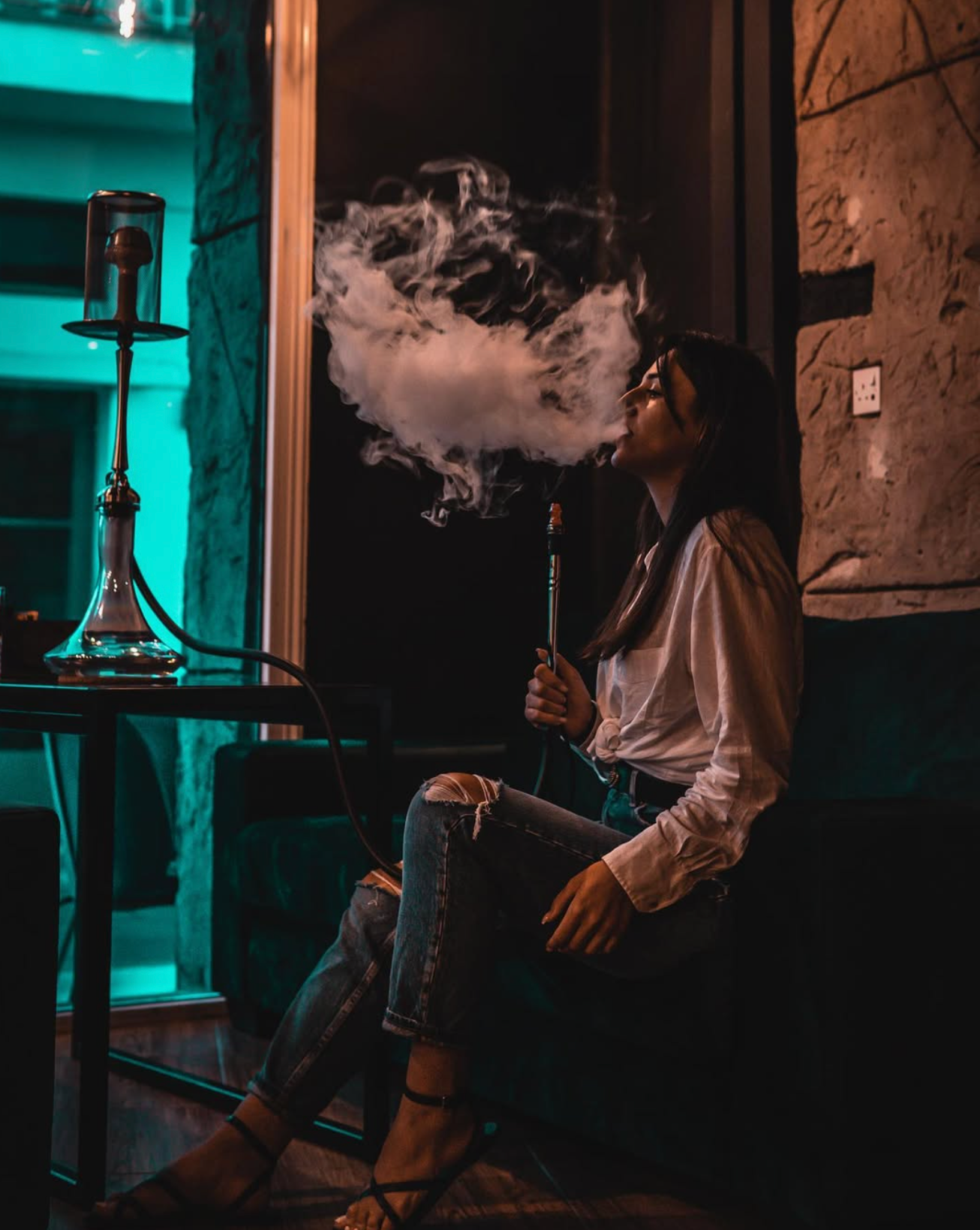 Exhaling shisha smoke